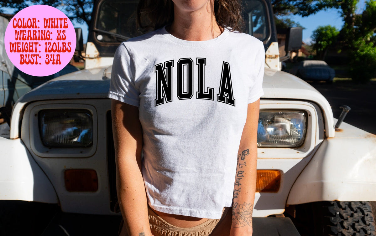 NOLA New Orleans Louisiana Baby Tee SNUG FIT Gifts Shirt Tshirt for Her Women Trendy Aesthetic 90s Y2K Summer Pink Blue White Grey Graphic Tee – Fan Favorite · Trending Graphic Apparel